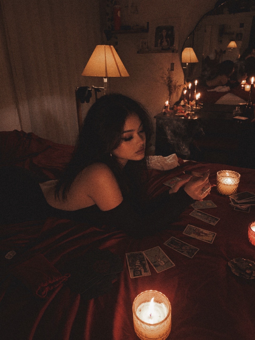 Layla reading tarot by candlelight